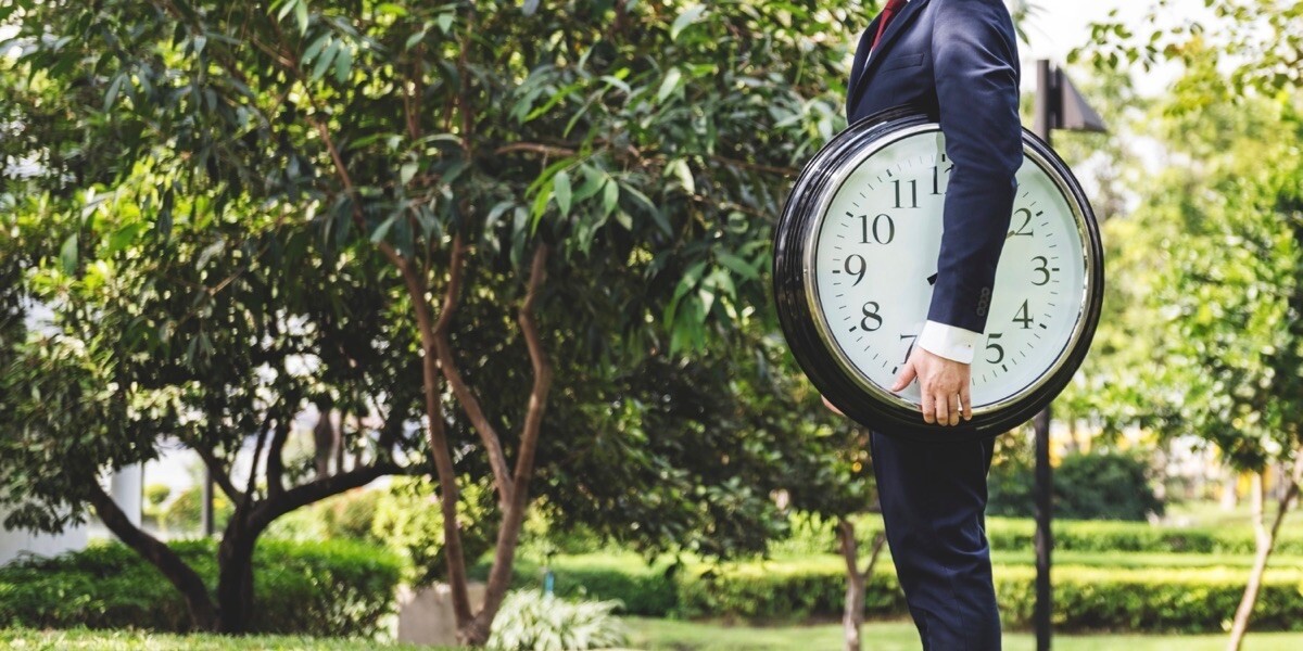 Big clock and businessman