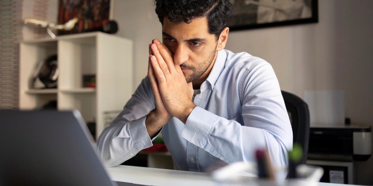 Man tired of remote meeting