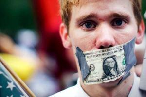 Man with mouth closed with dollar